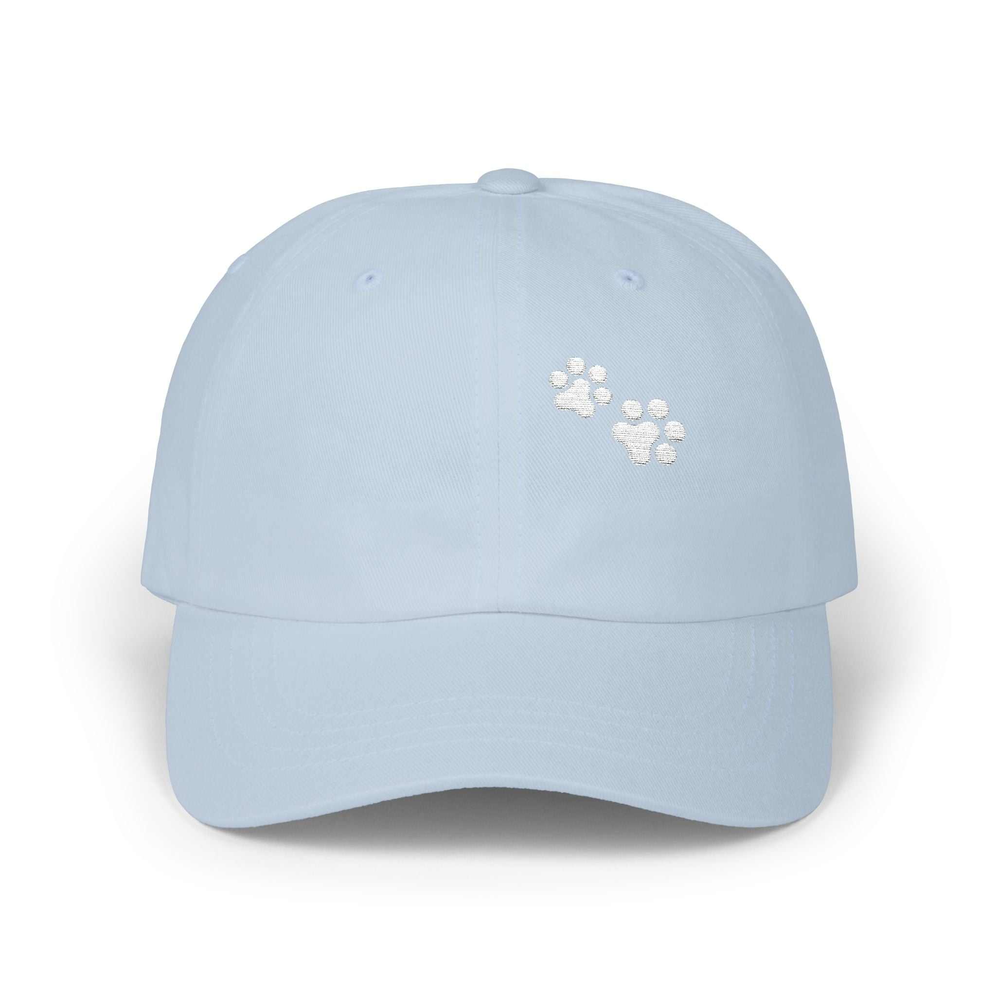 Classic dad cap with paw print, light blue color, adjustable fit, precurved visor.
