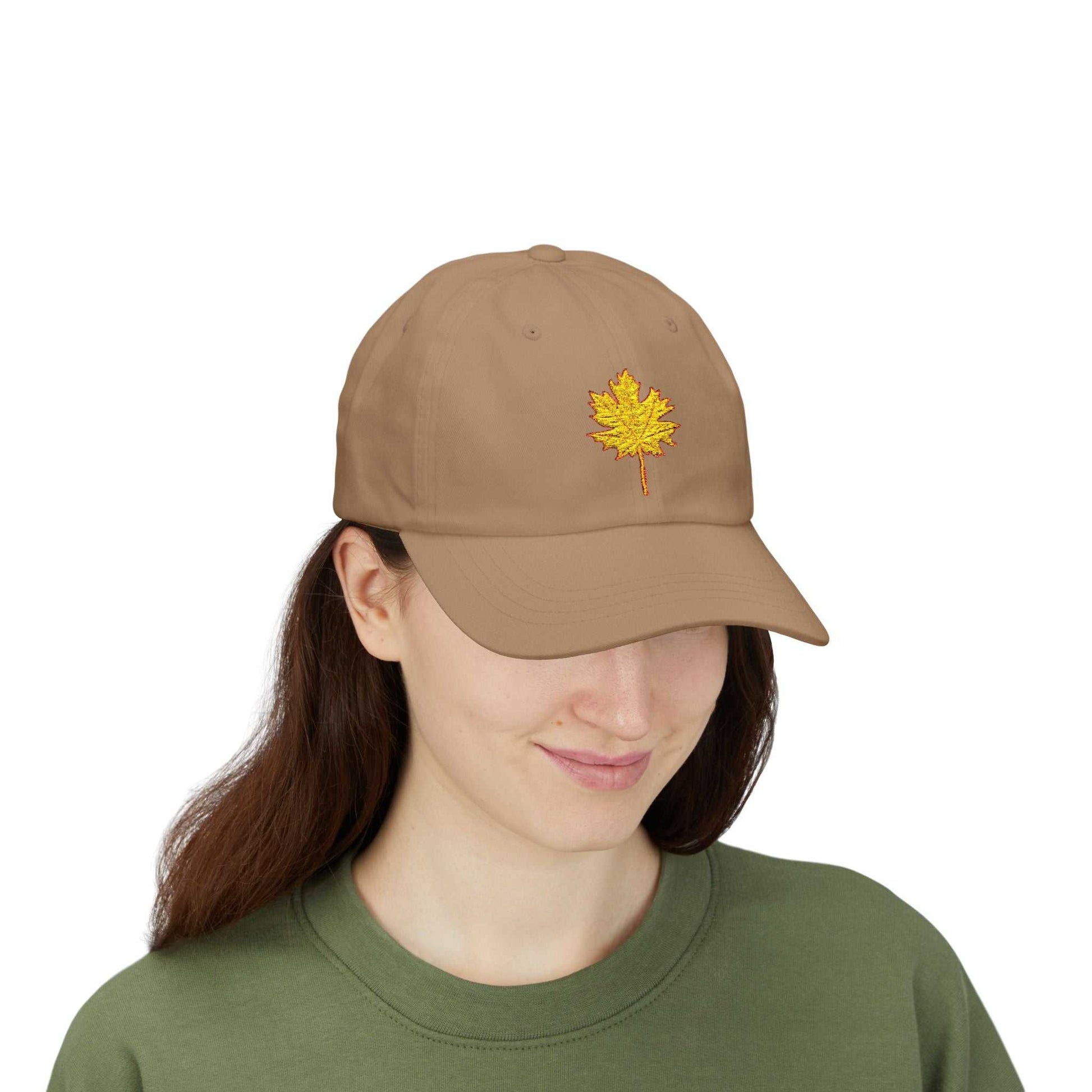 Tan Maple Leaf Dad Cap with embroidered maple leaf design, showcasing a relaxed fit and adjustable closure.