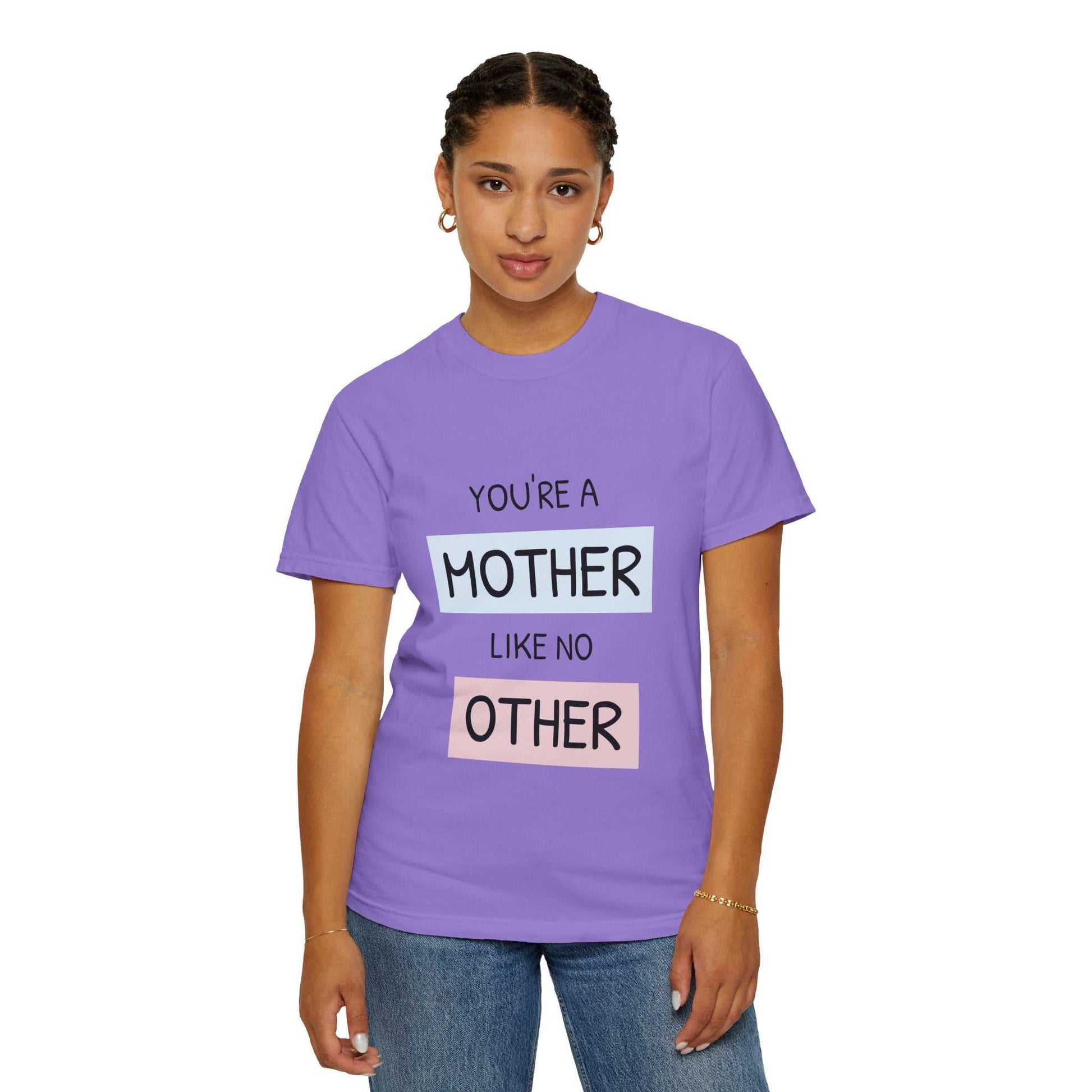 Woman wearing purple "You're a Mother Like No Other" T-shirt.