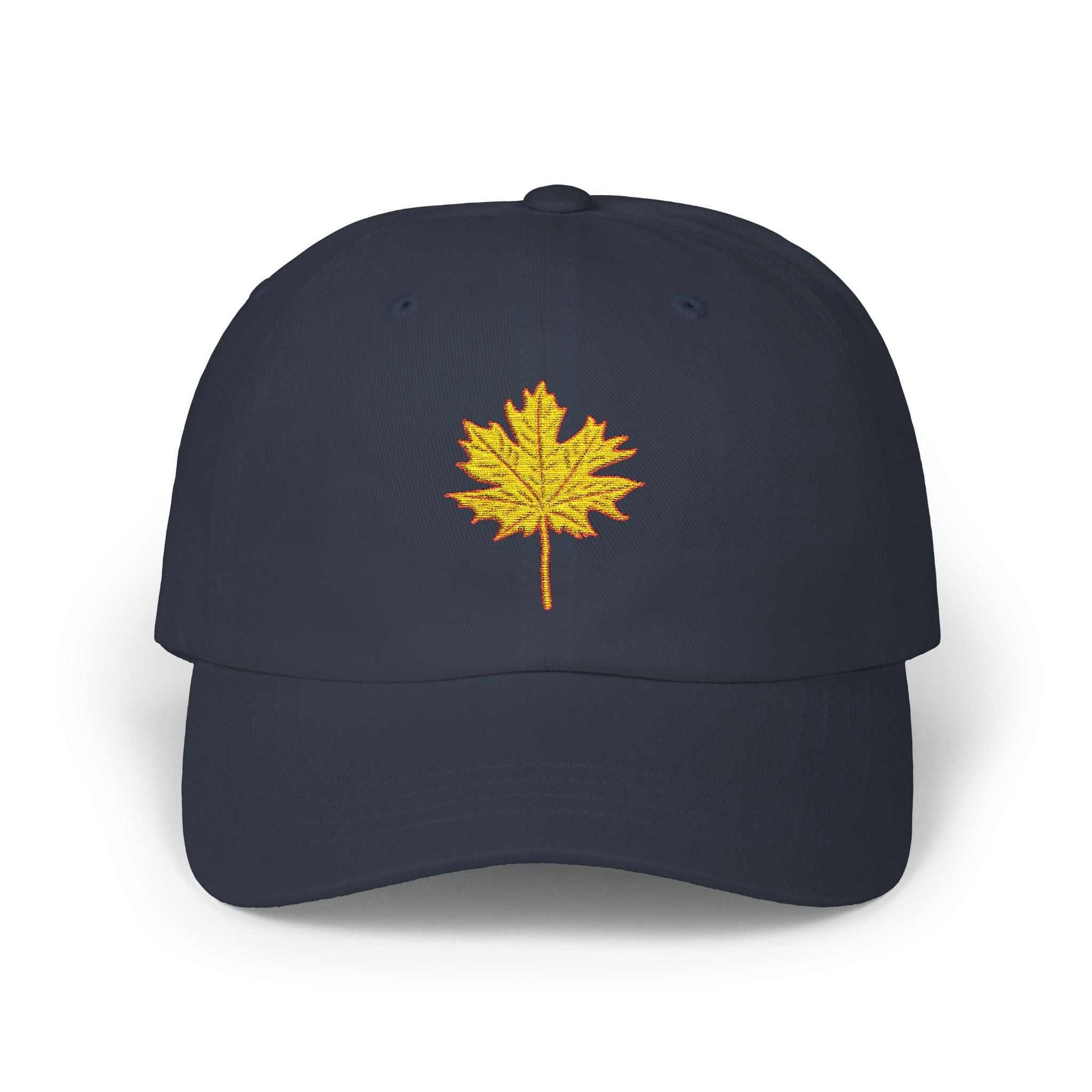 Navy blue dad cap with embroidered yellow maple leaf design, unstructured fit, adjustable snap closure.