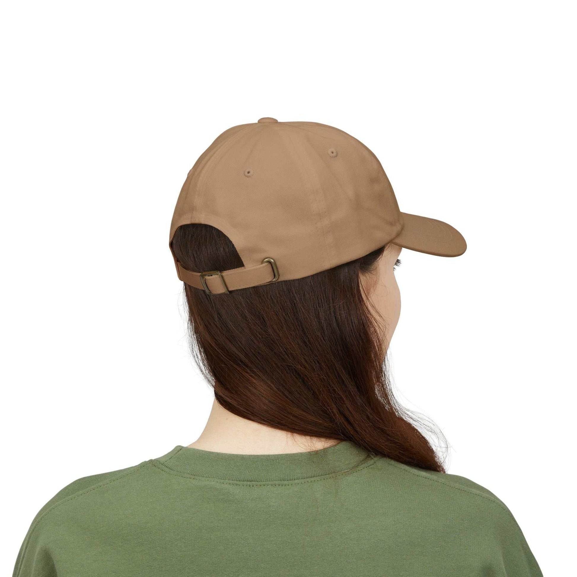 Maple Leaf Dad Cap in brown worn by person with adjustable strap and curved visor.