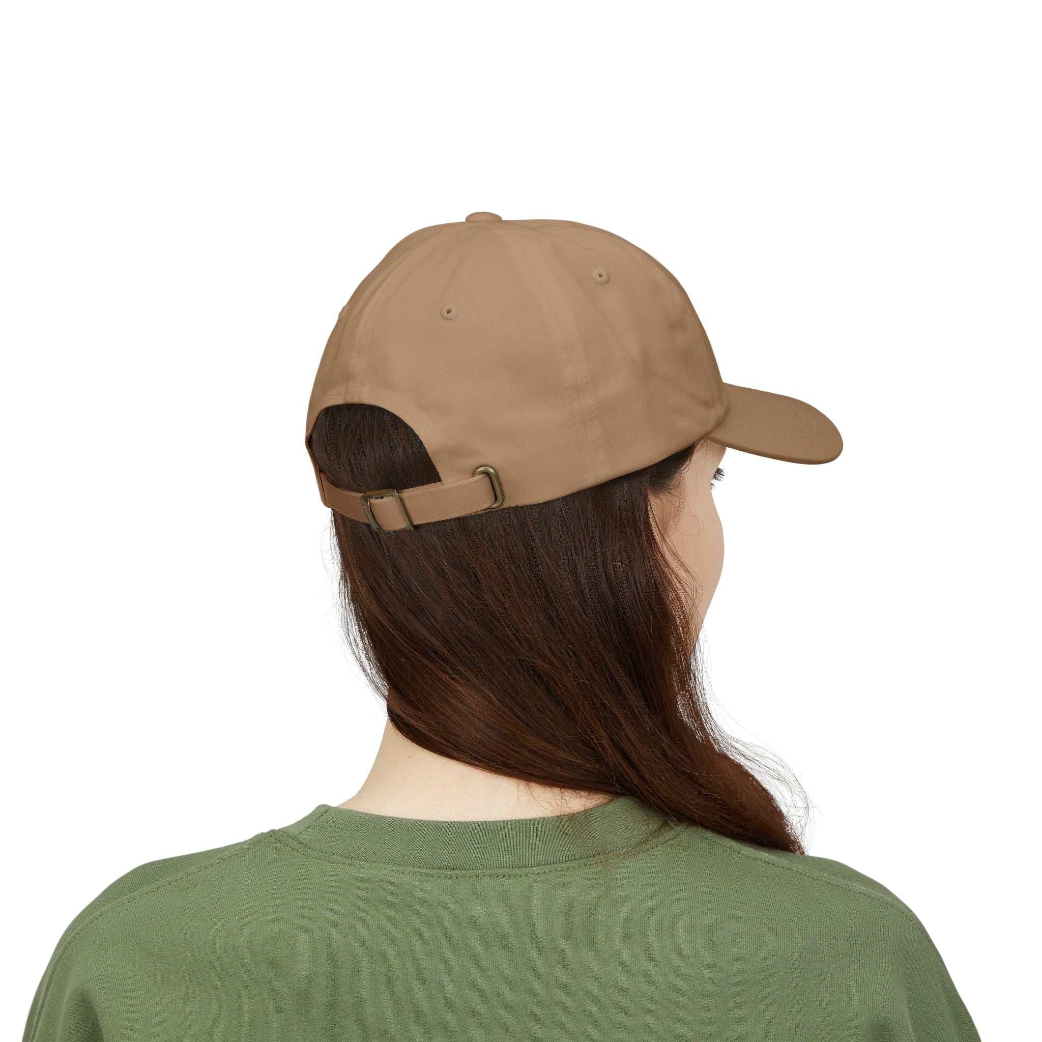 Maple Leaf Dad Cap in brown worn by person with adjustable strap and curved visor.