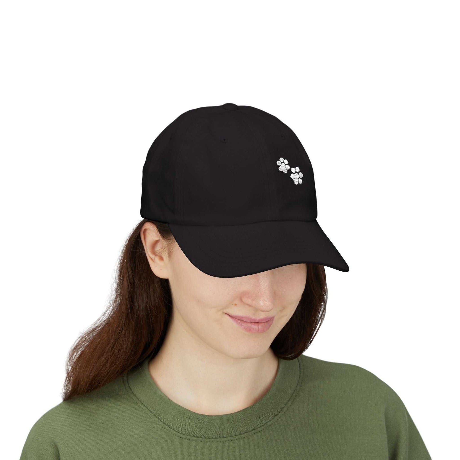 Classic black dad cap with paw print design, comfortable fit, adjustable strap, ideal for casual wear.