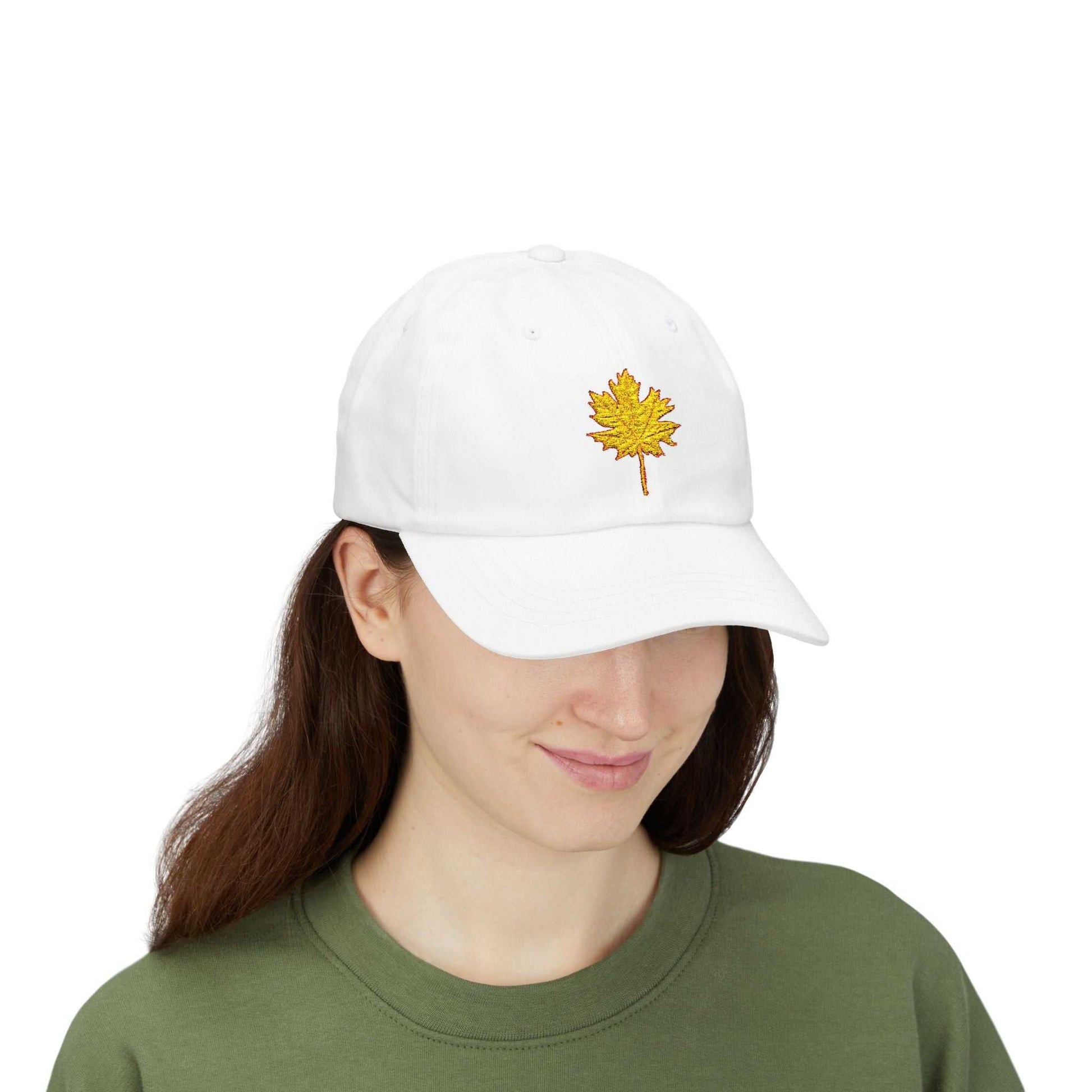 White Dad Cap with embroidered yellow maple leaf design.