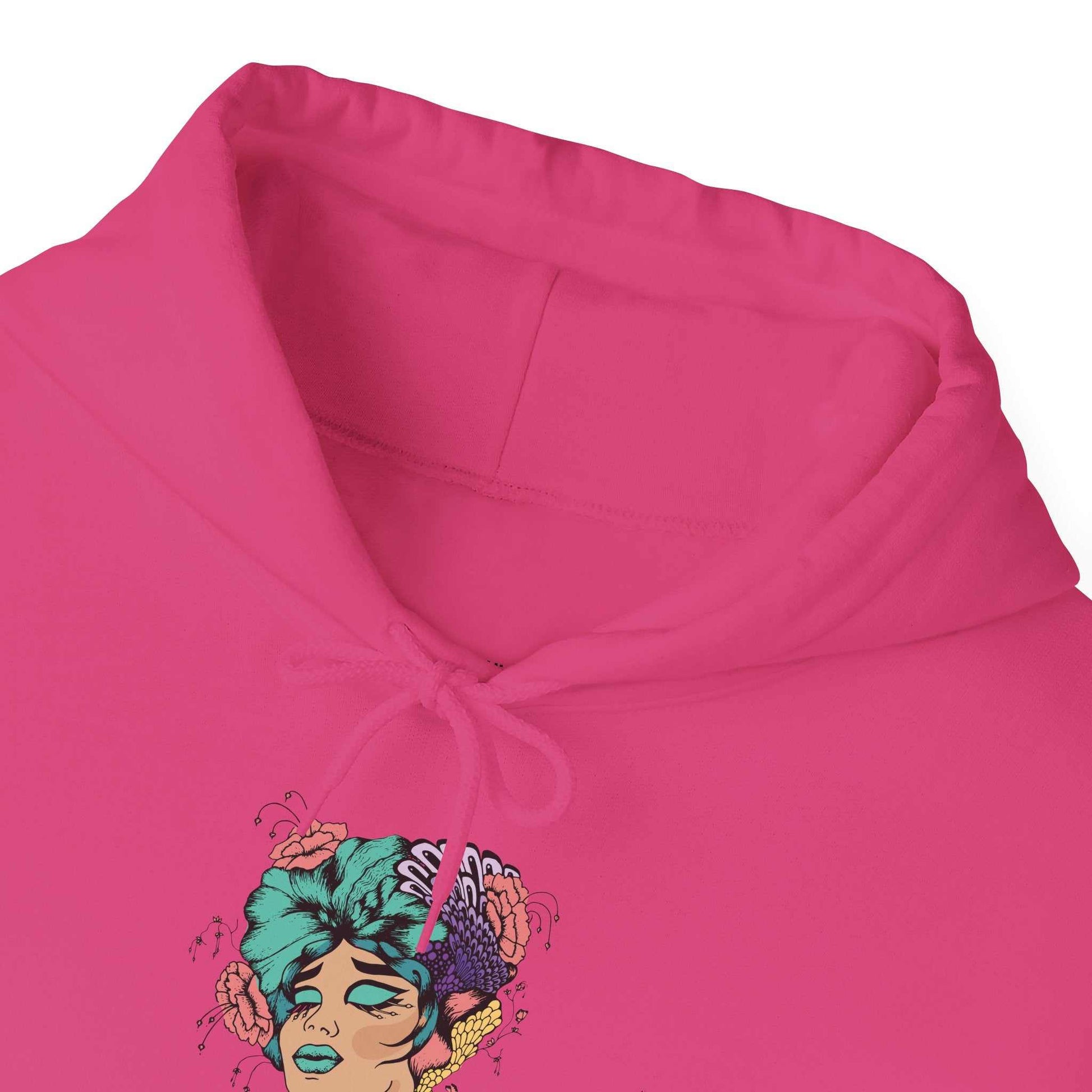 Boho style hooded sweatshirt with vibrant artistic design on pink fabric.