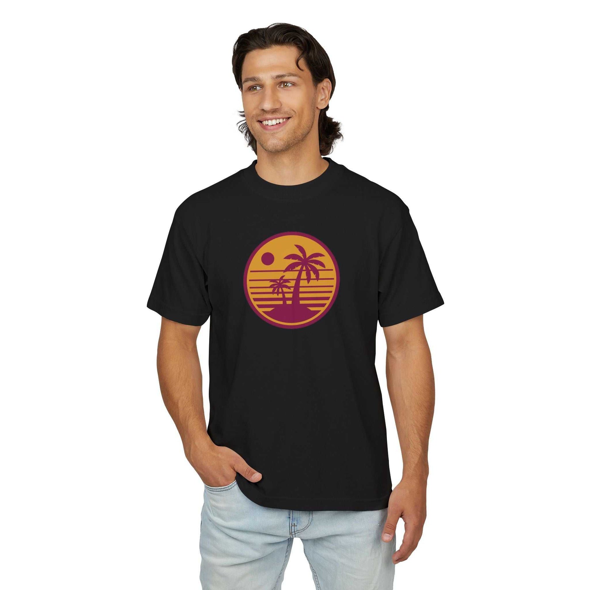 Unisex Urban Heavy Tee with retro sunset palm tree graphic, black color, worn by model.